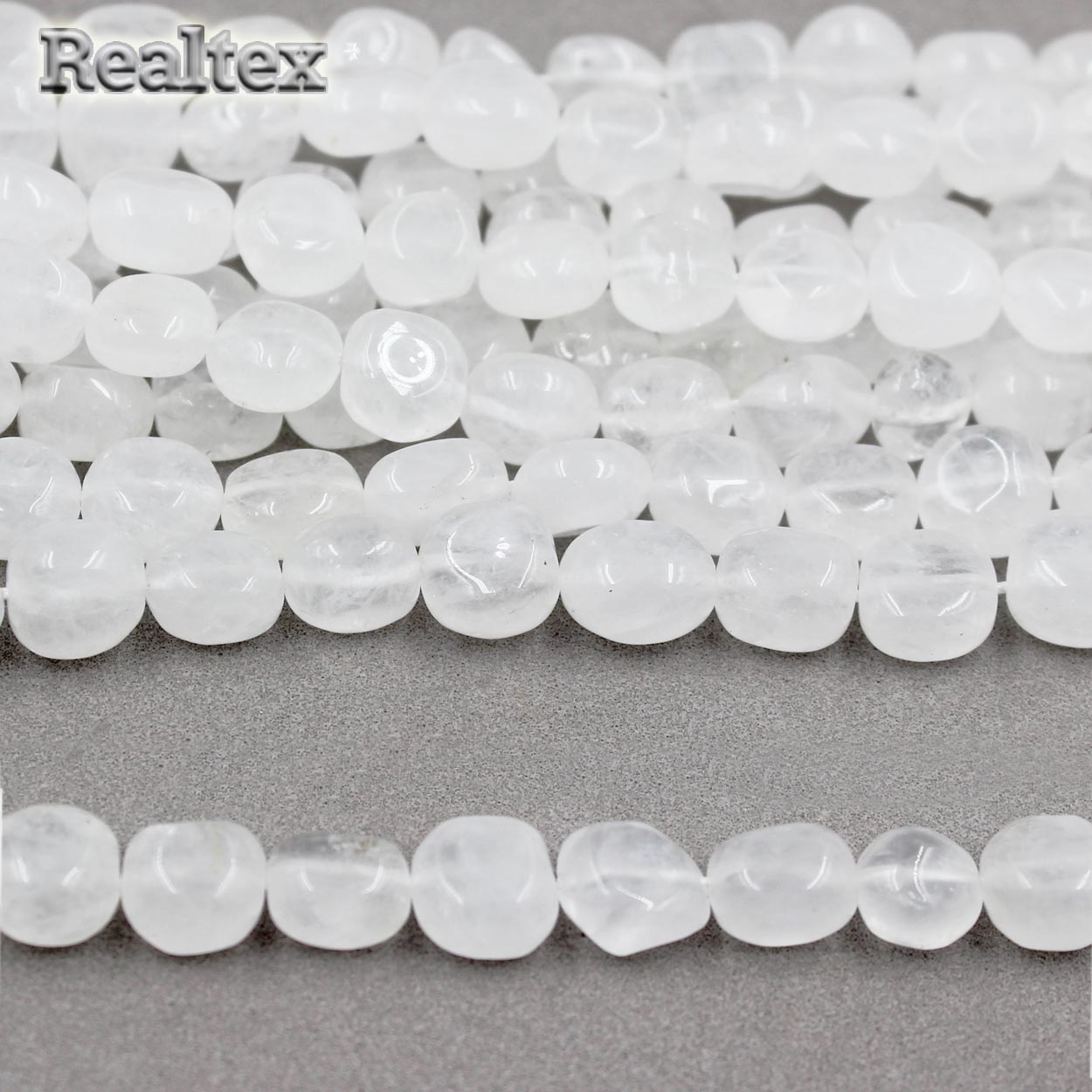 Бусины Реалтекс из натурального камня Горный Хрусталь 8*10мм дл.39см (38шт) цв.белый матовый