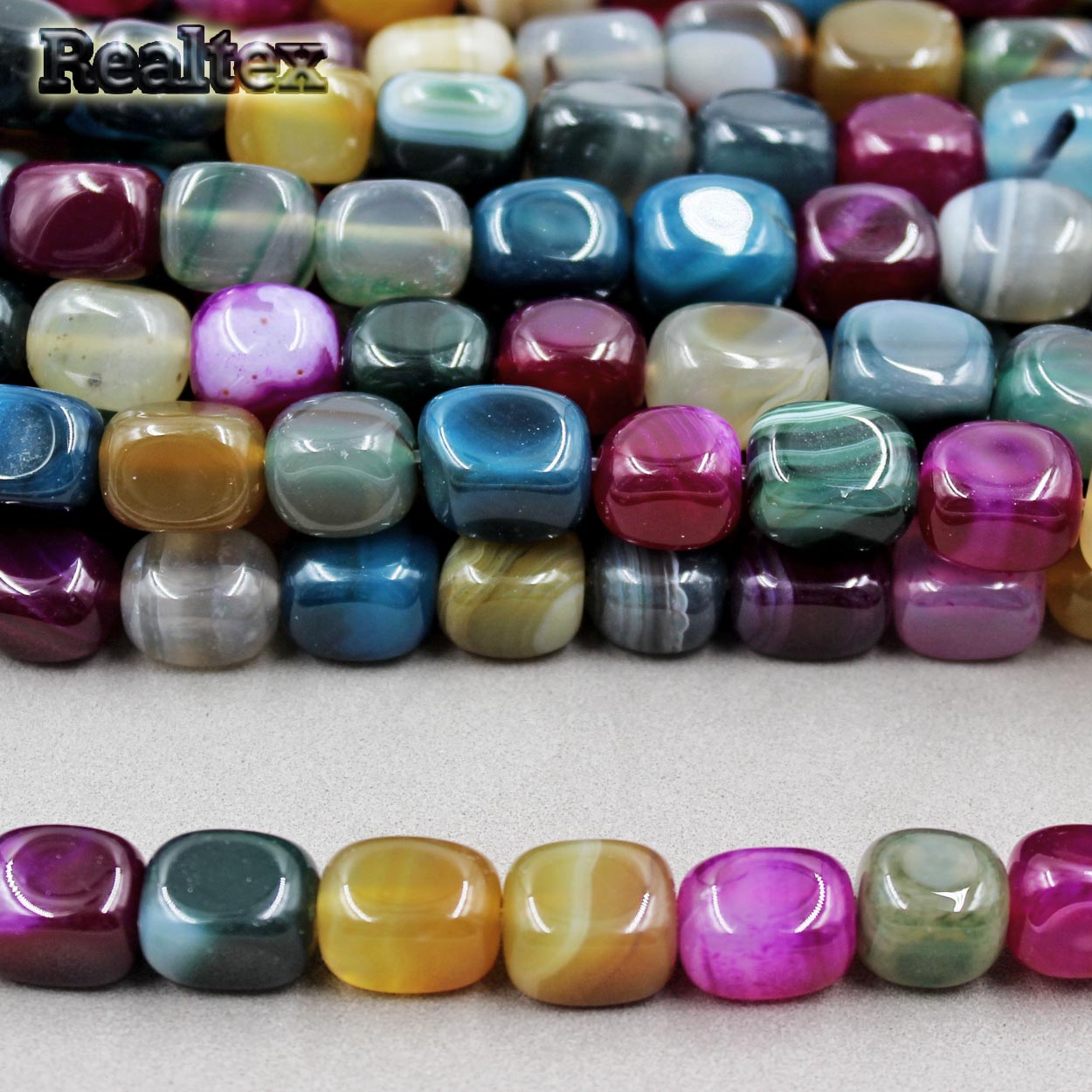 Бусины Реалтекс из натурального камня Агат галтованного 8*12мм дл.38см (32шт) цв.mix