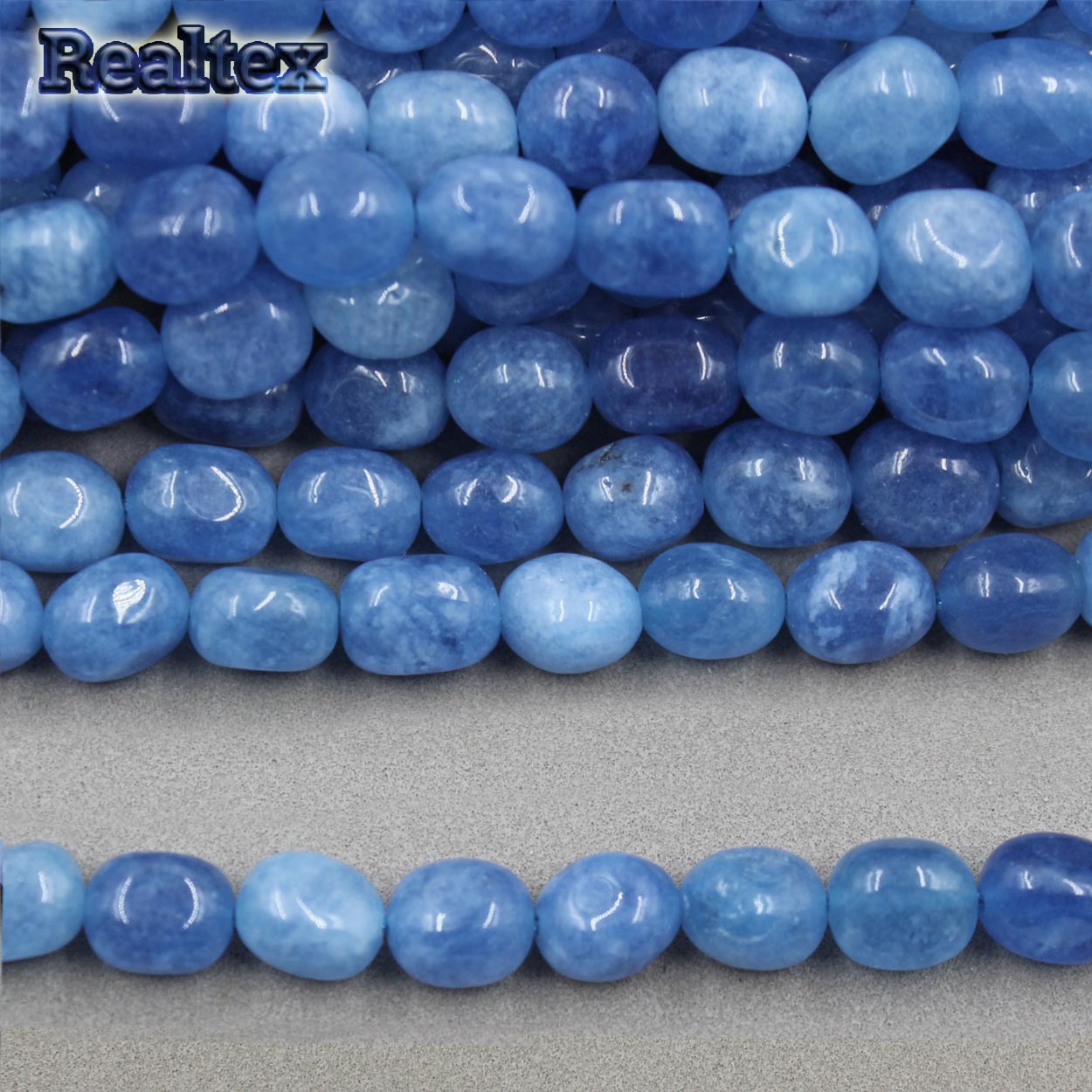 Бусины Реалтекс из натурального камня галтованного 8*10мм дл.38см (38шт) цв.темно-голубой