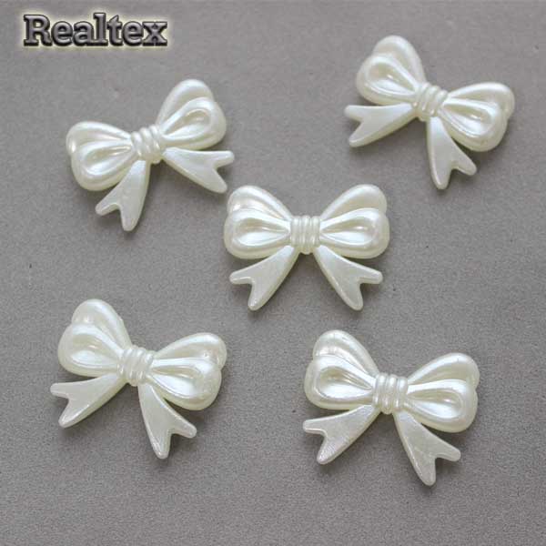 Бусины пластиковые Реалтекс Бантики (500гр) цв.молочный 