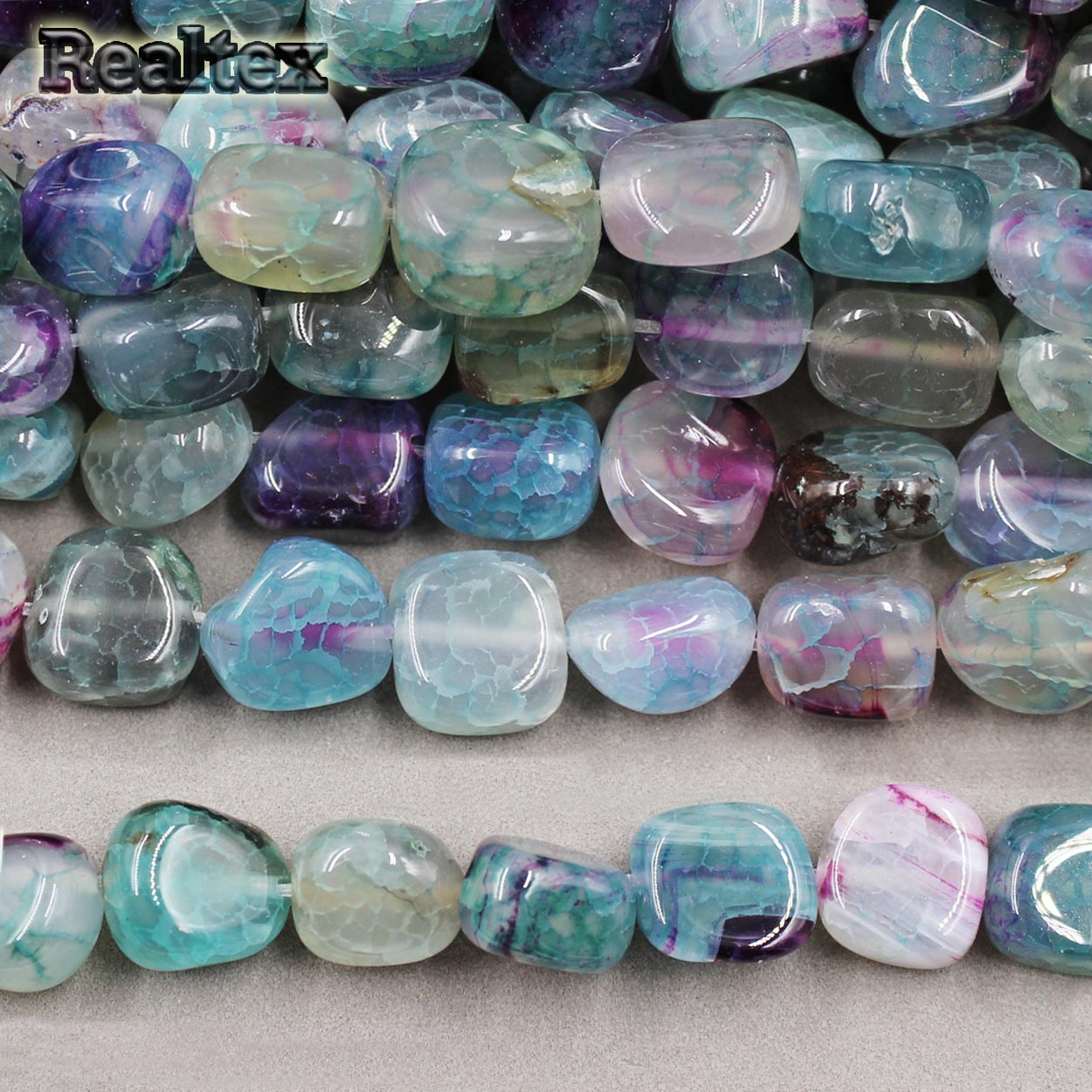 Бусины Реалтекс из натурального камня Агат галтованного 9*15мм дл.37см (24шт) цв.бирюзовый mix