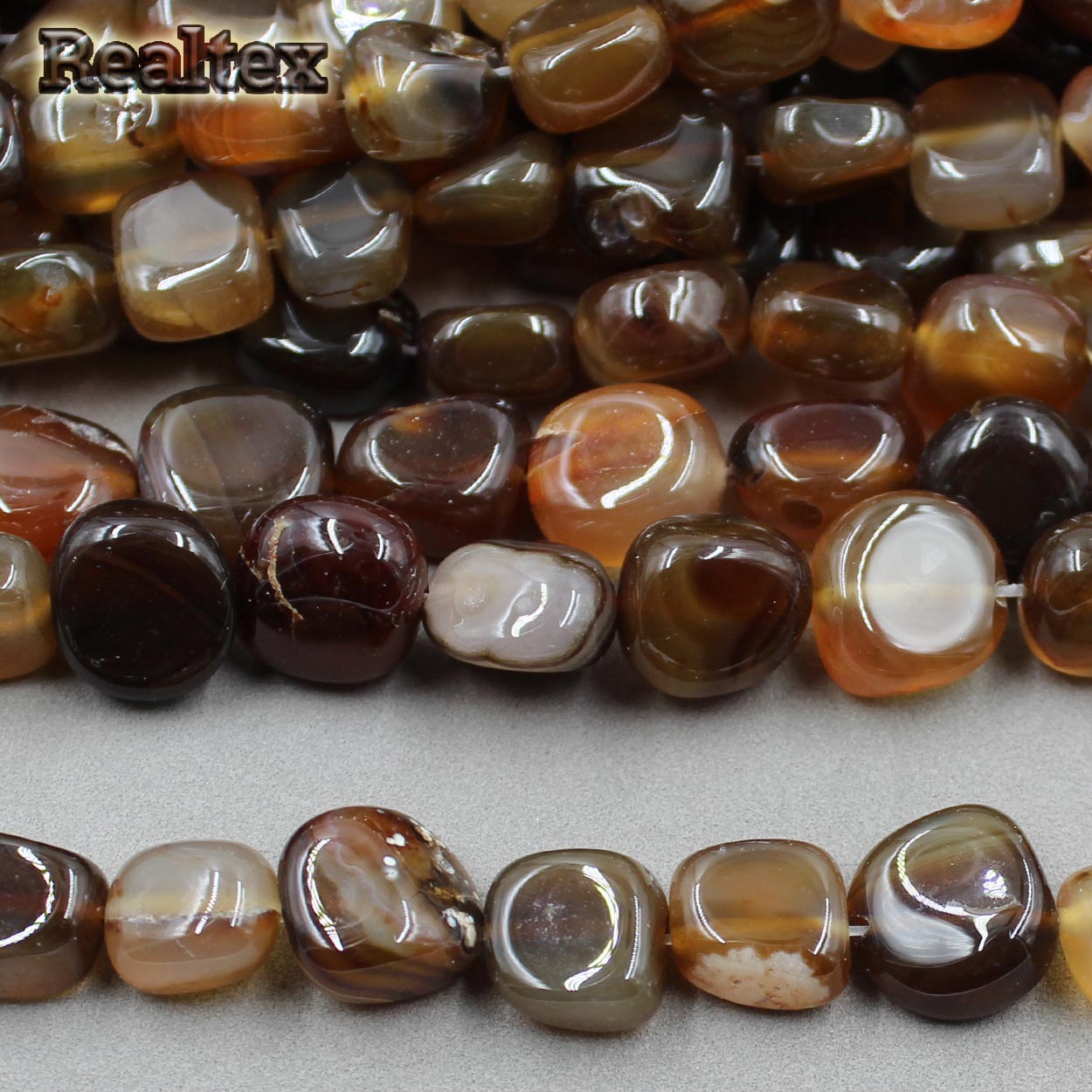 Бусины Реалтекс из натурального камня Агат галтованного 9*15мм дл.37см (24шт) цв.светло-коричневый mix