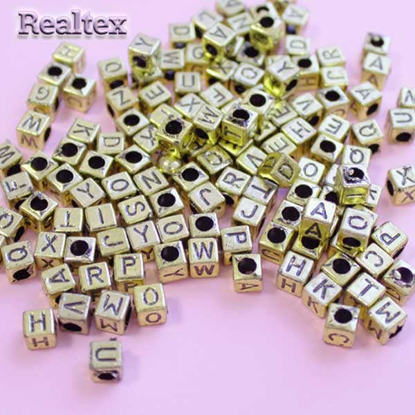 Бусины пластик Реалтекс английский алфавит 6*6мм (100гр) цв.золото