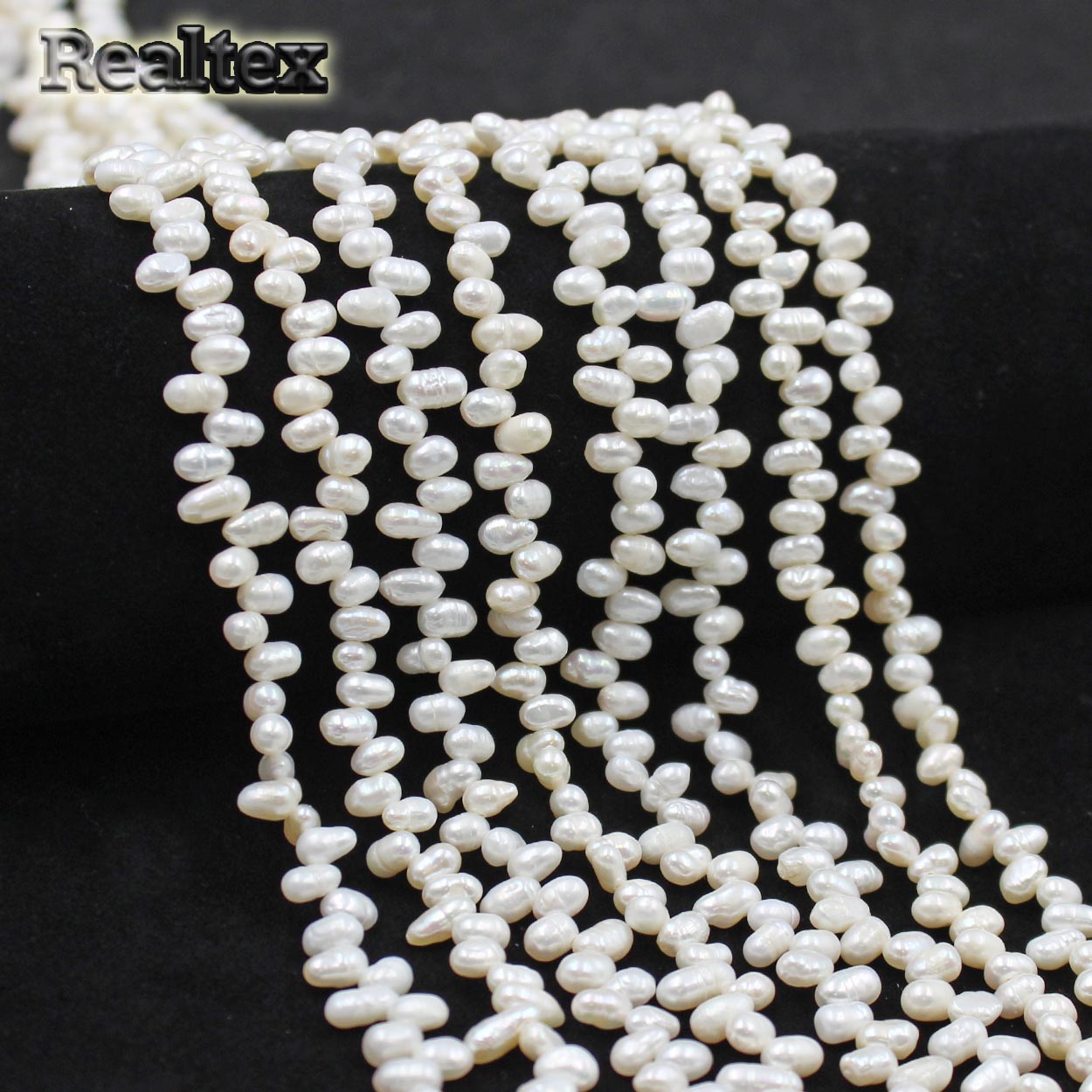 Бусины Realtex из Жемчуга Речного натурального барочного, Рис поперечный d=4-5мм дл.35,5см (100шт) цв.молочный