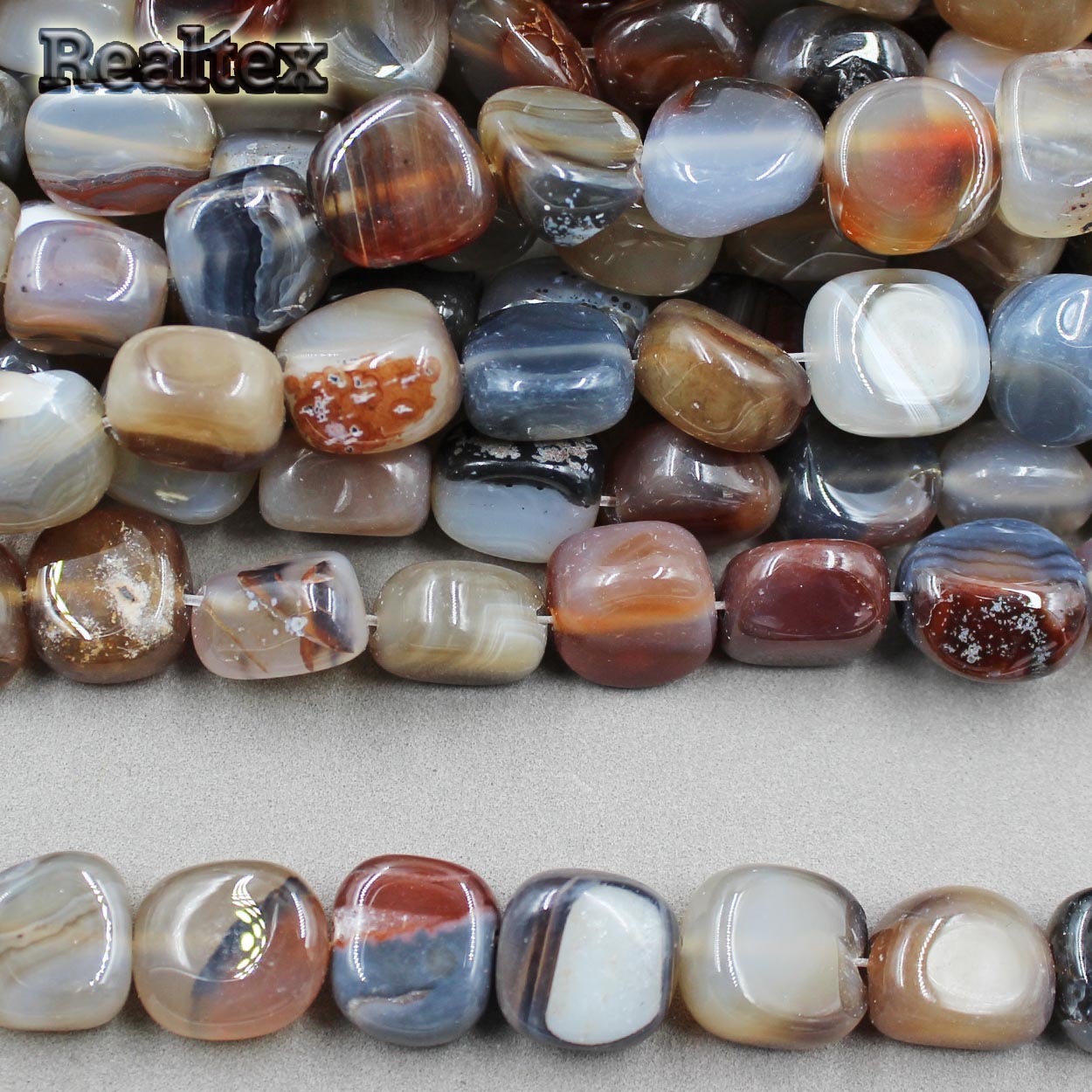 Бусины Реалтекс из натурального камня Агат галтованного 9*15мм дл.37см (24шт) цв.бежево-серый mix