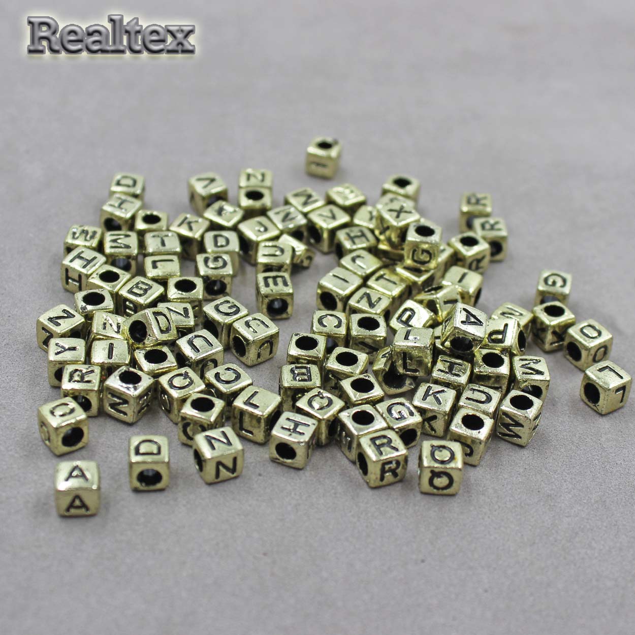 Бусины пластик Реалтекс Английский алфавит 6*6мм (500гр) цв.светлое золото