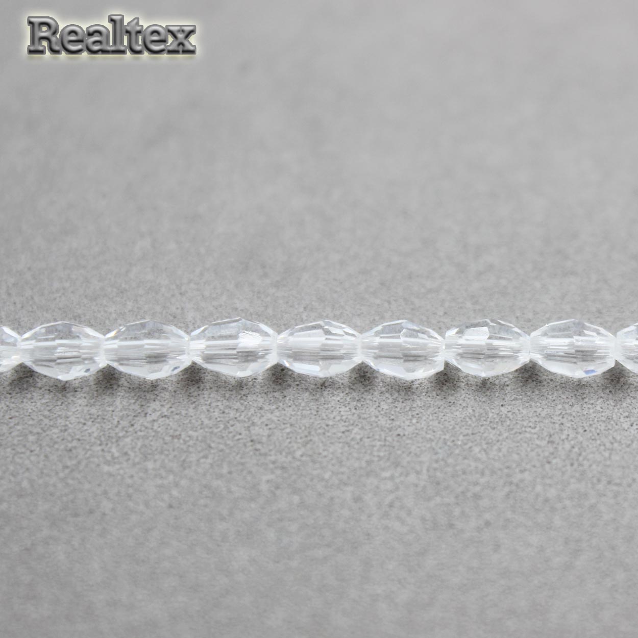 Бусины Реалтекс стеклянные граненые 4*6мм "Биконус" на нитях цв.01 белый