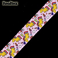 Лента репсовая с рисунком Реалтекс 25мм "Единорог" цв.желтый/розовый