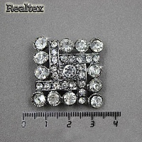 Брошь со стразами Realtex R-8-1 на планшете цв.черный никель 
